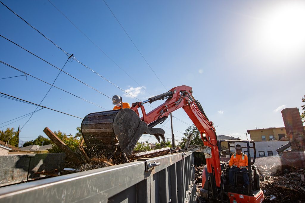 FMG crew operating an excavator to load a hauling truck